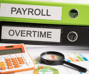 desk with overtime and payroll paperwork